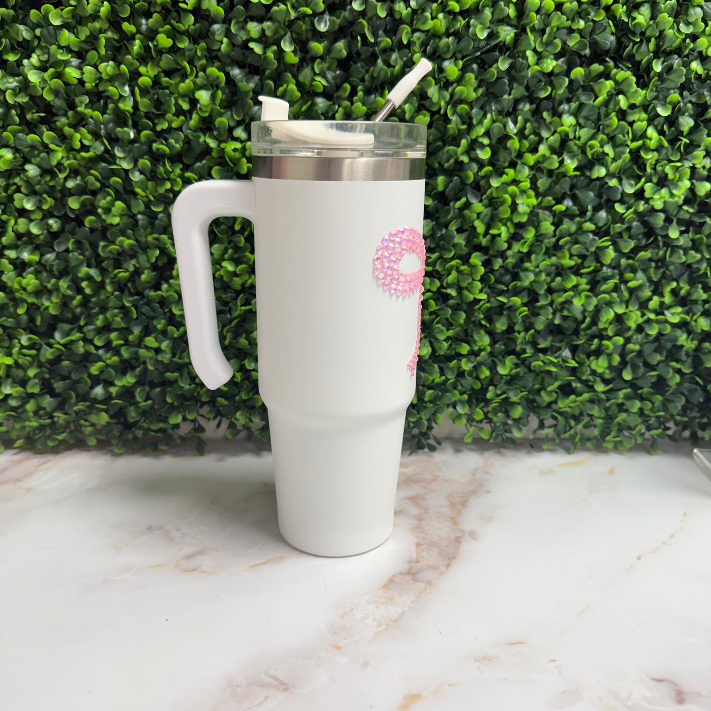 White tumbler with pink rhinestone bow