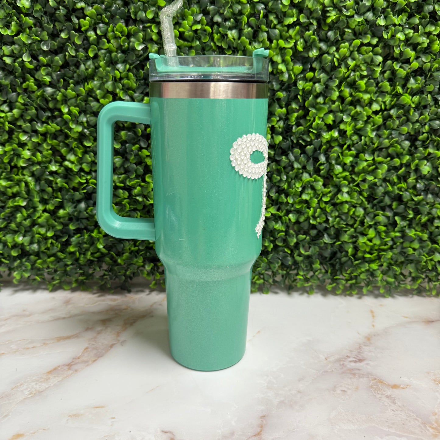 Teal tumbler with white rhinestone bow
