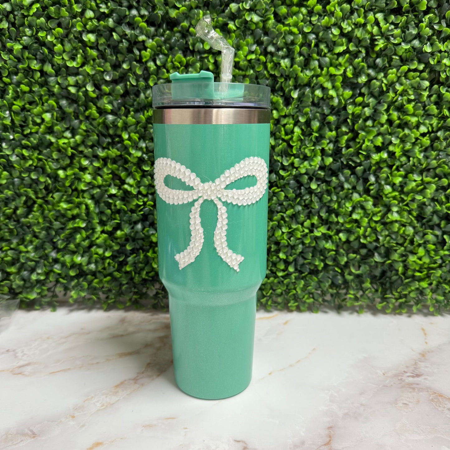 Teal tumbler with white rhinestone bow
